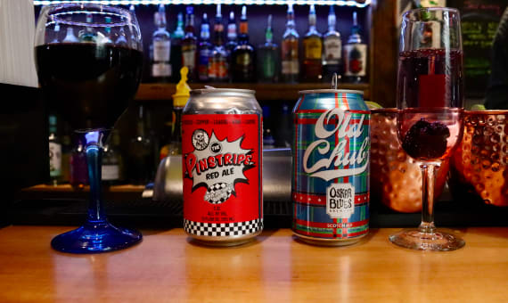 A variety of beers in various glasses and mugs.