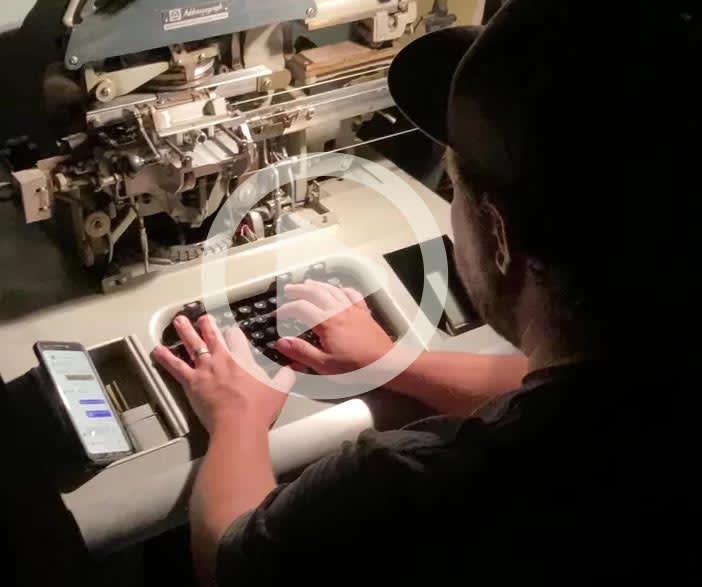A preview of a video showing dog tags being made.