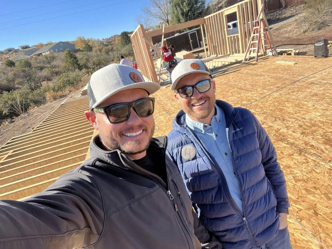 Kyle and Jeremey In Front of a Custom Home Being Built