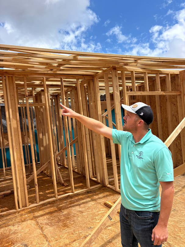 Kyle and Jeremey In Front of a Custom Home Being Built