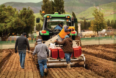 JV Smith team members using equipment to prepare fields for planting.