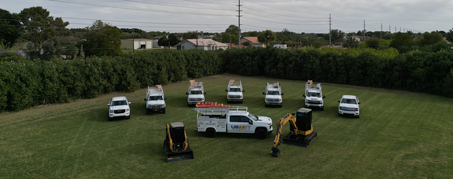 Liggett Electrical Services fleet of service trucks ready for field work.
