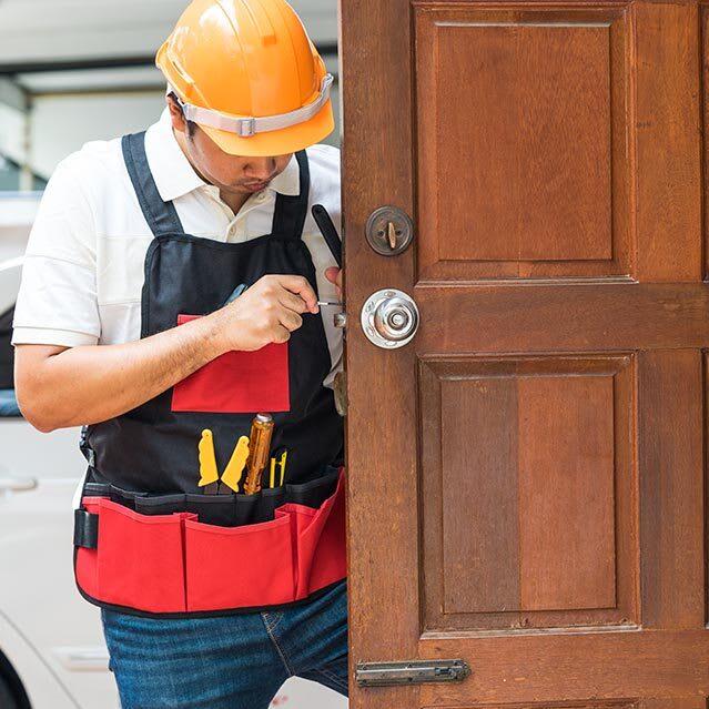 Locksmith Changing a front door's deadbolt