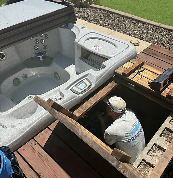 Employee fixing a hot tub in Prescott