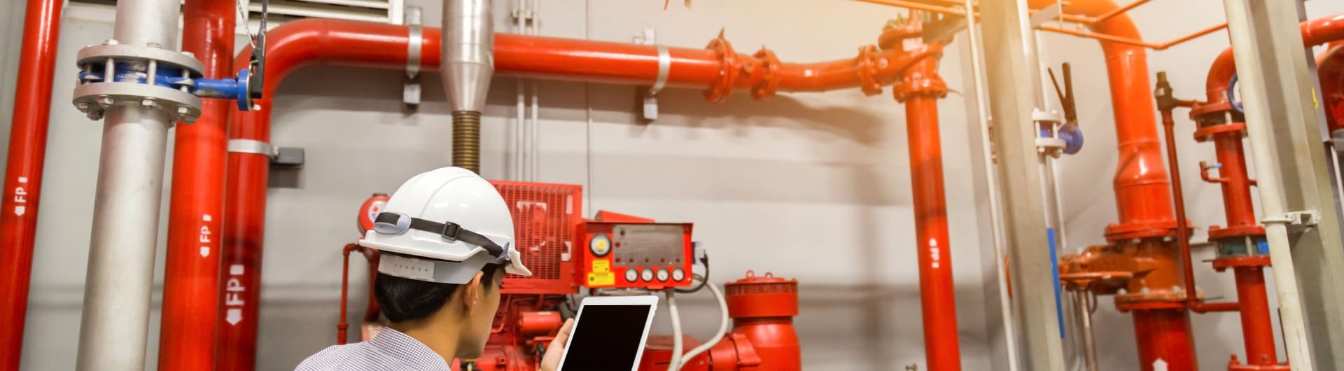 A Rock Fire employee checking the status of a high tech plumbing system