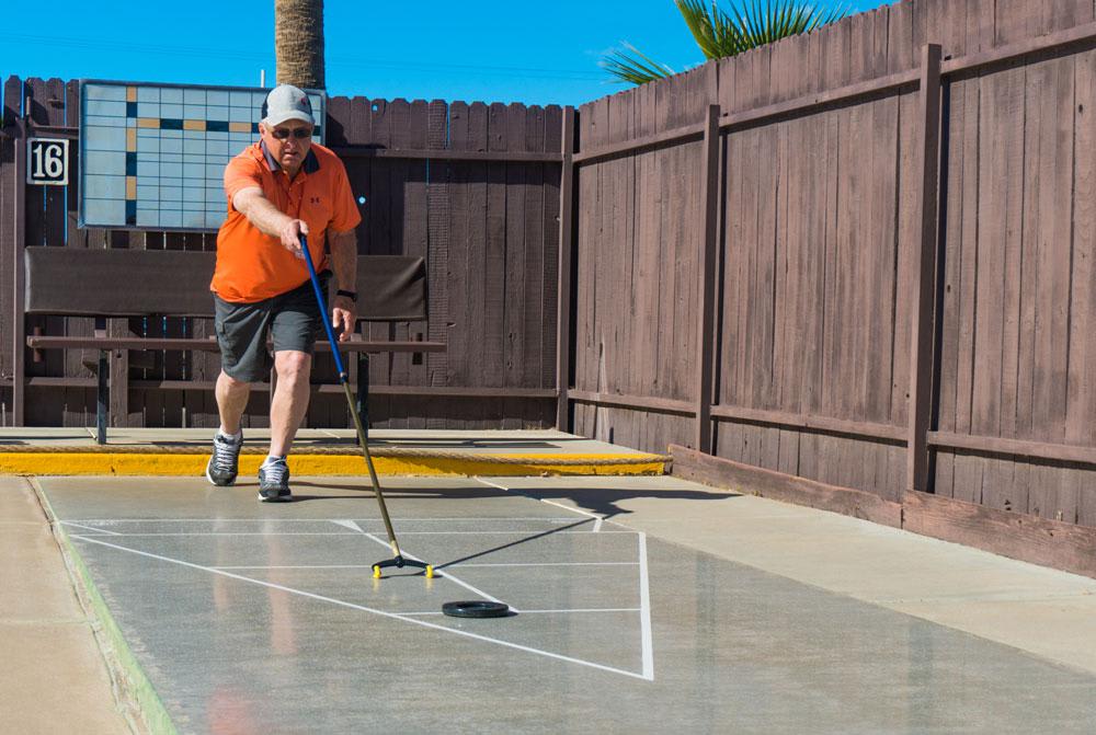 Residents enjoying the shuffleboard courts at Sun Vista RV Resort in Yuma, AZ