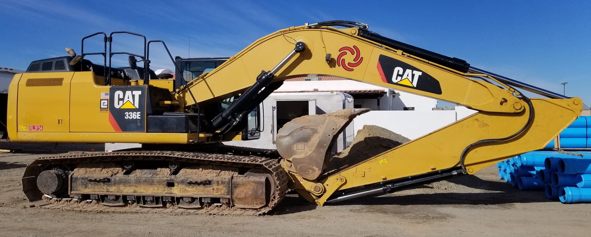Taylor Engineering excavator on a job site.