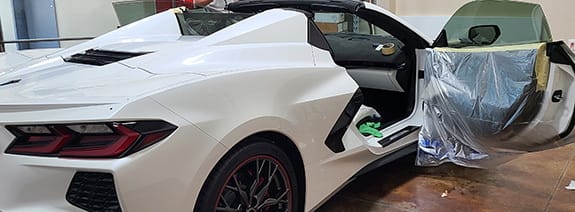 Corvette being protected while windows are being tinted