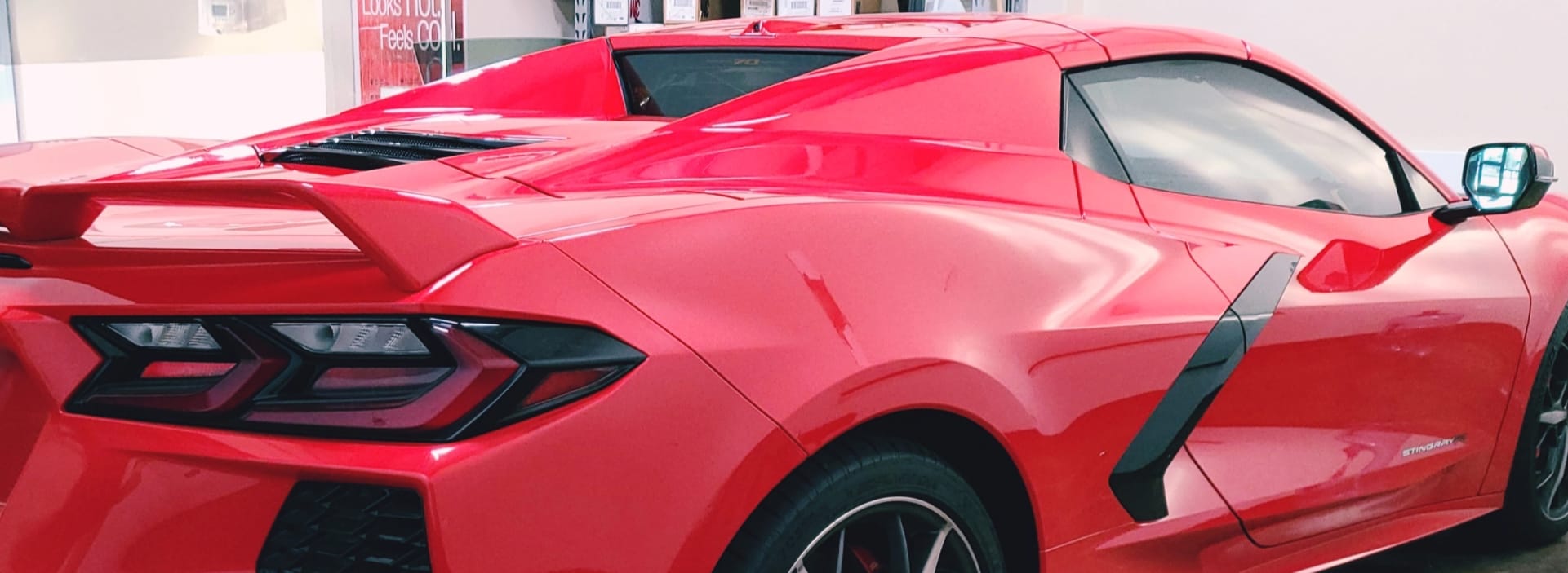 Red late-model Corvette with 3M Window Tint