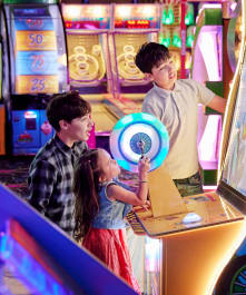 Children enjoying arcade games in the wild river arcade